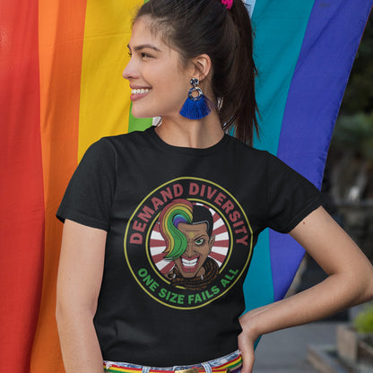 Person wearing a black t-shirt with a graphic design and text, standing in front of a rainbow flag. This gender equality t shirt highlights the need for a multi cultural society. Diversity improves growth, knowledge and understanding, demand it, One size never fits all. Versatility is a virtue. Made from 100% organic ring-spun cotton, this LGTBQ+ right t shirt is unisex, high-quality, super comfy, and best of all, eco-friendly.