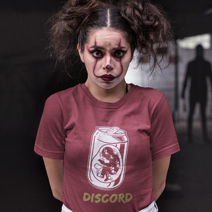 Person wearing a burgundy t-shirt with Discord logo and text, against a dark background. A Banksy style t-shirt suggesting a discord between modern generations and nature. A stencil art testament to the soda pop generation. Brought up on energy drinks and born with a Wi-Fi connection. Made from 100% organic ring-spun cotton, this street art t-shirt is unisex, high-quality, super comfy, and best of all, eco-friendly.