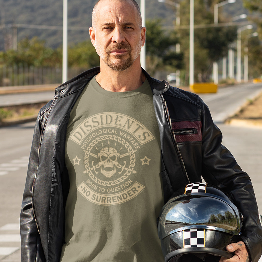 Man wearing a green t-shirt with text and a leather jacket holding a helmet on a road. An anti government t shirt suggesting we are living in a psychological war. Designed in a motorcycle club style, this dissident t shirt is for those among us that feel they are fighting for their freedom to think independently and to make their own choices. Made from 100% organic ring-spun cotton, this non conformist t shirt is unisex, high-quality, super comfy, and best of all, eco-friendly.