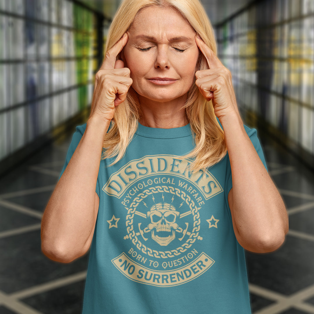 Person wearing a teal t-shirt with a graphic design and text. An anti government t shirt suggesting we are living in a psychological war. Designed in a motorcycle club style, this dissident t shirt is for those among us that feel they are fighting for their freedom to think independently and to make their own choices. Made from 100% organic ring-spun cotton, this non conformist t shirt is unisex, high-quality, super comfy, and best of all, eco-friendly.