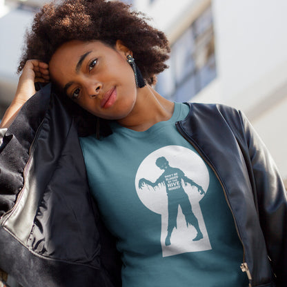 A woman wearing a teal graphic t-shirt with a white zombie silhouette. This funny non conformist t shirt warns against the effects of the hive mind. How do you ever know if you are wrong if everyone believes the same rhetoric ? Watch out for being infected by the hive mind of social apathy, ignorance and misinformation. Made from 100% organic ring-spun cotton, this counter culture t shirt is unisex, high quality, super comfy, and best of all, eco-friendly.
