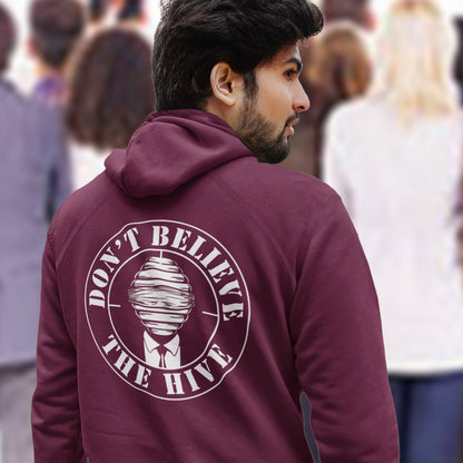 Man wearing a burgundy hoodie with 'Don't Believe the Hive' text and logo. A anti establishment hoodie. In an ever increasing world of media influence and misinformation, can 'The Majority' be trusted any more ? Don't get blinded by the hive minded. Support independent thought with this unique hoodie. Comfortable and practical. It's extra soft and has a convenient front pouch pocket. Made from organic cotton and recycled polyester, this social awareness hoodie is a great eco-friendly choice.