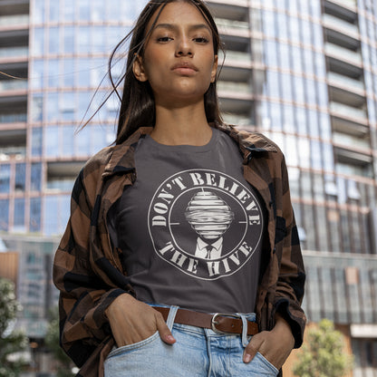 Person wearing a t-shirt with 'Don't Believe The Hype' design in an urban setting. A street art t shirt design for an ever increasing world of media influence and misinformation. Can 'The Majority' be trusted any more ? Don't get blinded by the hive minded. Support independent thought with this unique urban art t shirt. Made from 100% organic ring-spun cotton, this social awareness t shirt is unisex, high-quality, super comfy, and best of all, eco-friendly.