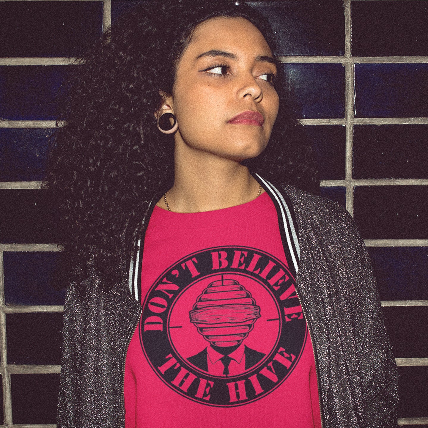 Person wearing a red t-shirt with a graphic and text against a tiled wall background A street art t shirt design for an ever increasing world of media influence and misinformation. Can 'The Majority' be trusted any more ? Don't get blinded by the hive minded. Support independent thought with this unique urban art t shirt. Made from 100% organic ring-spun cotton, this social awareness t shirt is unisex, high-quality, super comfy, and best of all, eco-friendly.