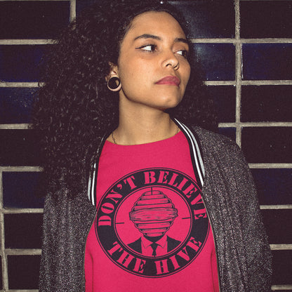 Person wearing a red t-shirt with a graphic and text against a tiled wall background A street art t shirt design for an ever increasing world of media influence and misinformation. Can 'The Majority' be trusted any more ? Don't get blinded by the hive minded. Support independent thought with this unique urban art t shirt. Made from 100% organic ring-spun cotton, this social awareness t shirt is unisex, high-quality, super comfy, and best of all, eco-friendly.