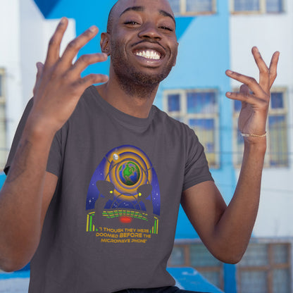 Man throwing his hands up in the air wearing a funny alien t shirt. A funny alien t shirt satirically exposing the dangers of microwaves. We probably seem quite masochistic from an outsiders point of view and the aliens must wonder what we are doing in the name of progression. A global warming t shirt design for alien fans. Made from 100% organic ring-spun cotton, this cool sci fi t shirt is unisex, high-quality, super comfy, and best of all, eco-friendly.