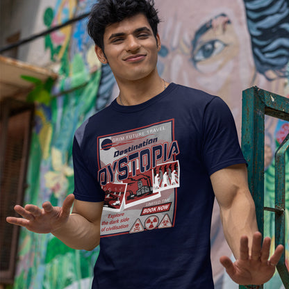 Man wearing a 'Destination Dystopia' t-shirt in front of a colourful mural. This funny dystopian t-shirt design is a clever play on a tourism poster promoting dystopia as a satirical holiday destination. If you feel that our system of inequality will render any holiday to the western world a holiday in Dystopia, this design will truly represent your feelings. Made from 100% organic ring-spun cotton, this broken society t shirt is unisex, high-quality, super comfy, and best of all, eco-friendly.