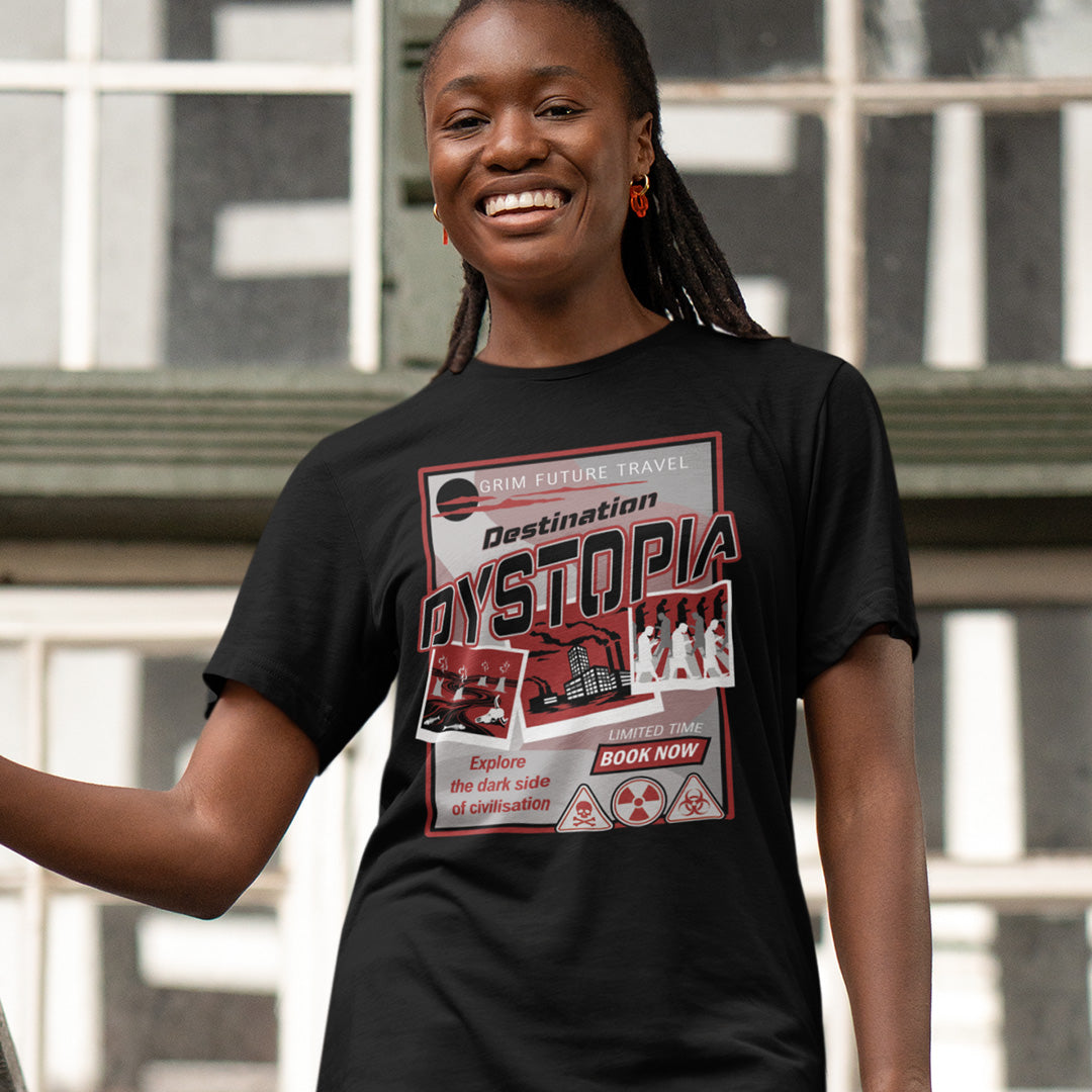 Person wearing a black t-shirt with a dystopian design in front of a building. This funny dystopian t-shirt design is a clever play on a tourism poster promoting dystopia as a satirical holiday destination. If you feel that our system of inequality will render any holiday to the western world a holiday in Dystopia, this design will truly represent your feelings. Made from 100% organic ring-spun cotton, this broken society t shirt is unisex, high-quality, super comfy, and best of all, eco-friendly.