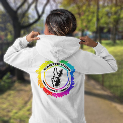 Person wearing a white hoodie with a colourful logo and text in an outdoor setting. This ant-prejudice hoodie is LGTBQ+ friendly and anti-racism. We are all Earthlings and can live in peace and harmony if we put aside our prejudice and fear. This original design promotes social awareness and unity. Comfortable and practical. It's extra soft and has a convenient front pouch pocket. Made from organic cotton and recycled polyester, this anti prejudice hoodie is a great eco-friendly choice.