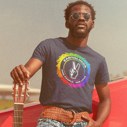 Man wearing a t-shirt with a rainbow peace symbol design, holding a guitar. This ant-prejudice t-shirt is LGTBQ+ friendly and anti-racism. We are all Earthlings and can live in peace and harmony if we put aside our prejudice and fear. This original design promotes social awareness and unity. Made from 100% organic ring-spun cotton, this anti prejudice t-shirt is unisex, high-quality, super comfy, and best of all, eco-friendly.