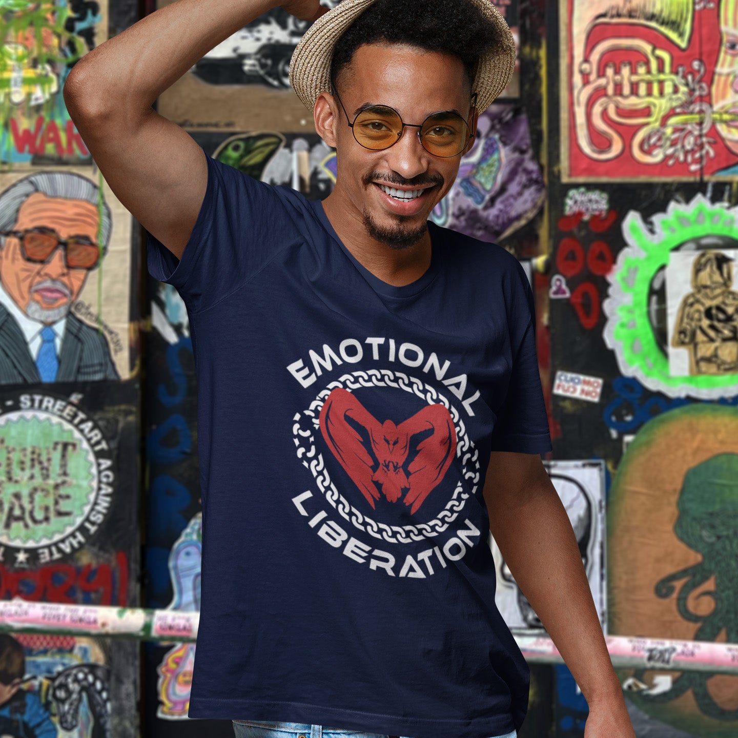 Man wearing a French navy blue t-shirt with 'Emotional Liberation' design in front of a colourful wall. This self esteem t shirt is for sentient based beings. This design promotes the liberation of emotions in a material world. Oppose the rise of apathy and the fall of compassion by embracing your emotions and being proud of them. Made from 100% organic ring-spun cotton, this self worth t shirt is unisex, high quality, super comfy, and best of all, eco-friendly.