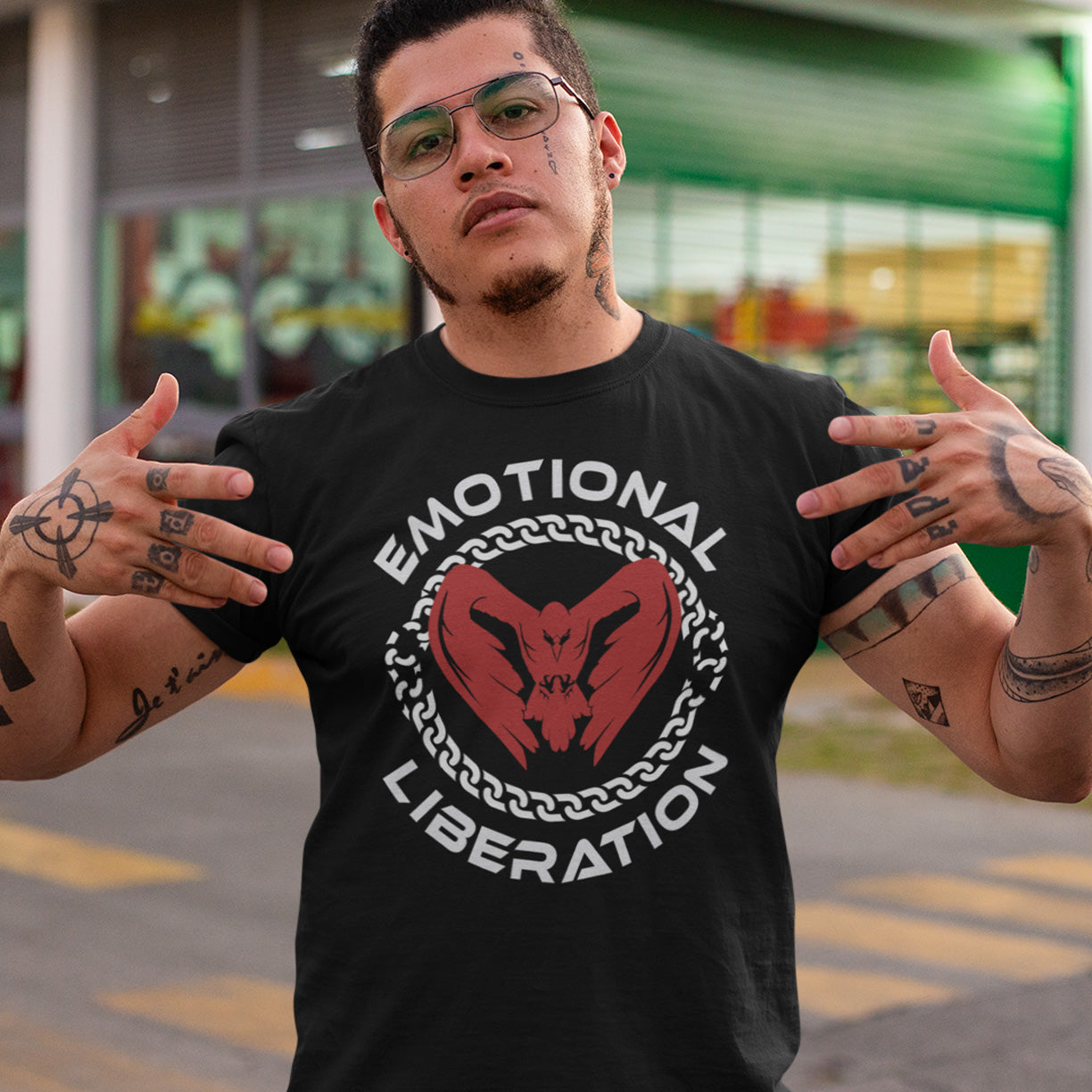 Man wearing a black t-shirt with 'Emotional Liberation' design, standing outdoors. This self esteem t shirt is for sentient based beings. This design promotes the liberation of emotions in a material world. Oppose the rise of apathy and the fall of compassion by embracing your emotions and being proud of them. Made from 100% organic ring-spun cotton, this self worth t shirt is unisex, high quality, super comfy, and best of all, eco-friendly.