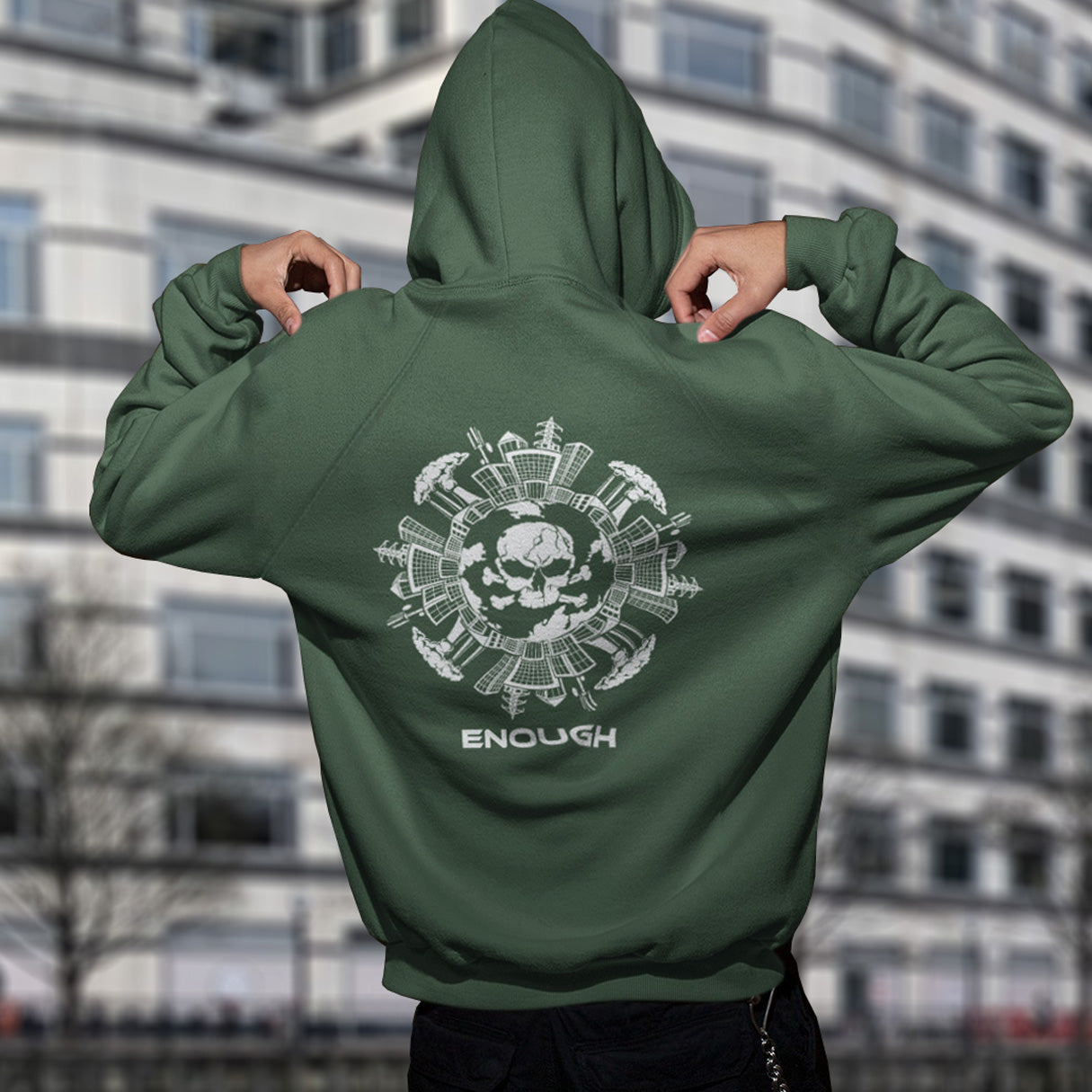 Person wearing an 'overcrowding' design on a bottle green hoodie. An environmental hoodie highlighting an overcrowding concern. This original design is for all nature lovers who think that enough is enough and don't want to live in a concrete jungle. Comfortable and practical. It's extra soft and has a convenient front pouch pocket. Made from organic cotton and recycled polyester, this social awareness hoodie is a great eco-friendly choice.