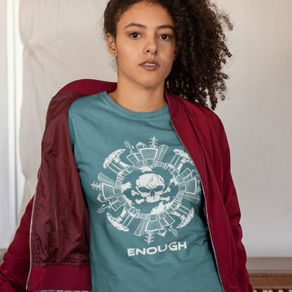 Person wearing a stargazer t-shirt with a graphic design and the word 'ENOUGH' text, paired with a red jacket. An environmental t-shirt highlighting an overcrowding concern. This original design is for all nature lovers who think that enough is enough and don't want to live in a concrete jungle. Made from 100% organic ring-spun cotton, this social political t-shirt is unisex, high-quality, super comfy, and best of all, eco-friendly.