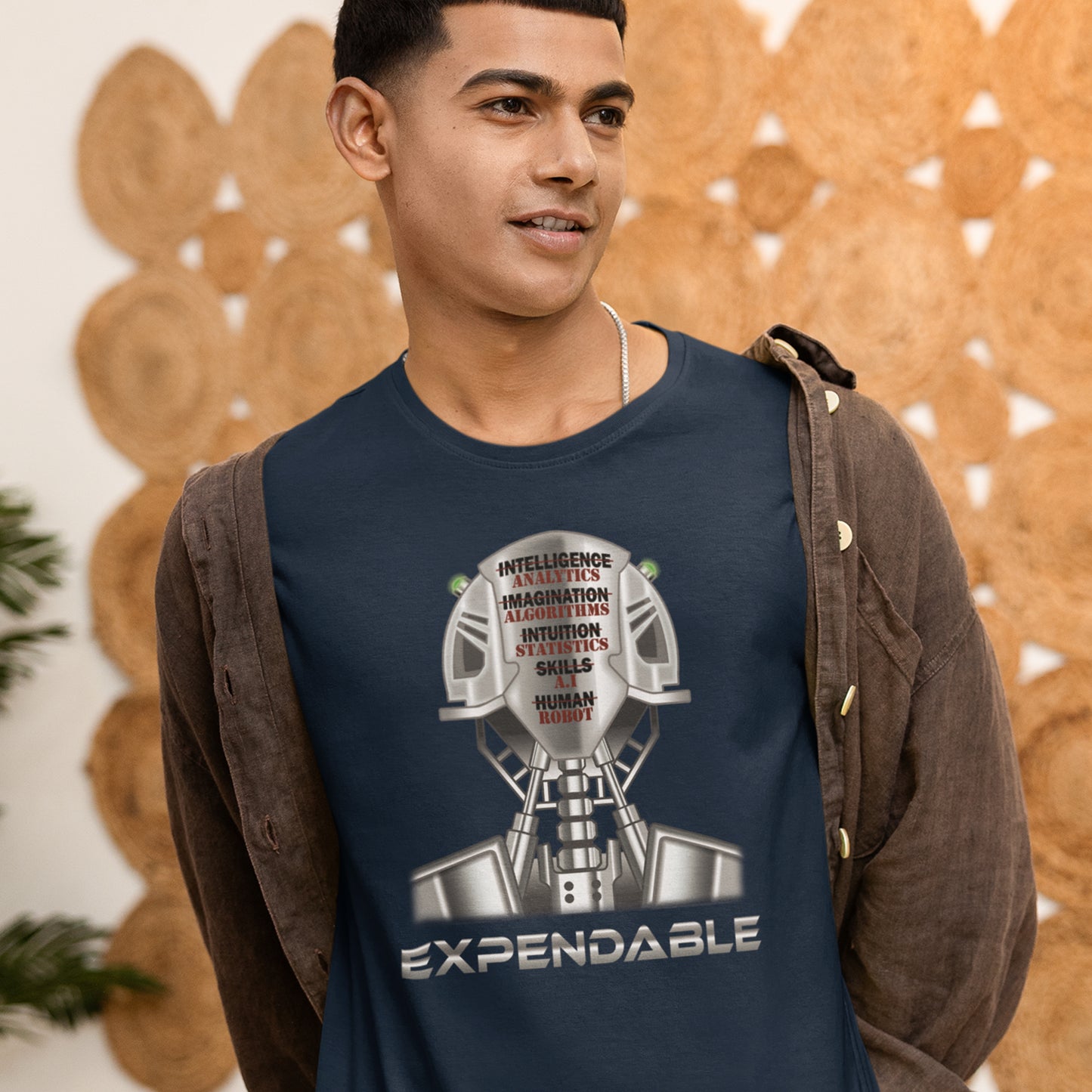 Man wearing a navy blue t-shirt with a graphic design and text, standing against a decorative wall. An anti-technology t-shirt suggesting that too many attributes of human development are being replaced by a computer program, is it time to worry about our role as humans ? Counterculture and alternative view of technology. Made from 100% organic ring-spun cotton, this social awareness, anti technology t-shirt is unisex, high-quality, super comfy, and best of all, eco-friendly.