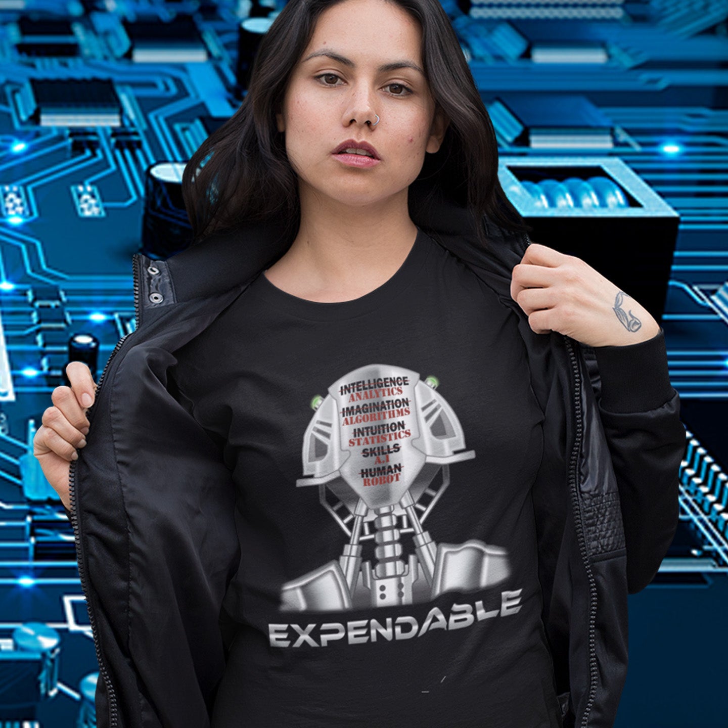 Person wearing a black t-shirt with a robot graphic and text, standing against a futuristic blue background. An anti-technology t-shirt suggesting that too many attributes of human development are being replaced by a computer program, is it time to worry about our role as humans ? Counterculture and alternative view of technology. Made from 100% organic ring-spun cotton, this social awareness, anti technology t-shirt is unisex, high-quality, super comfy, and best of all, eco-friendly.