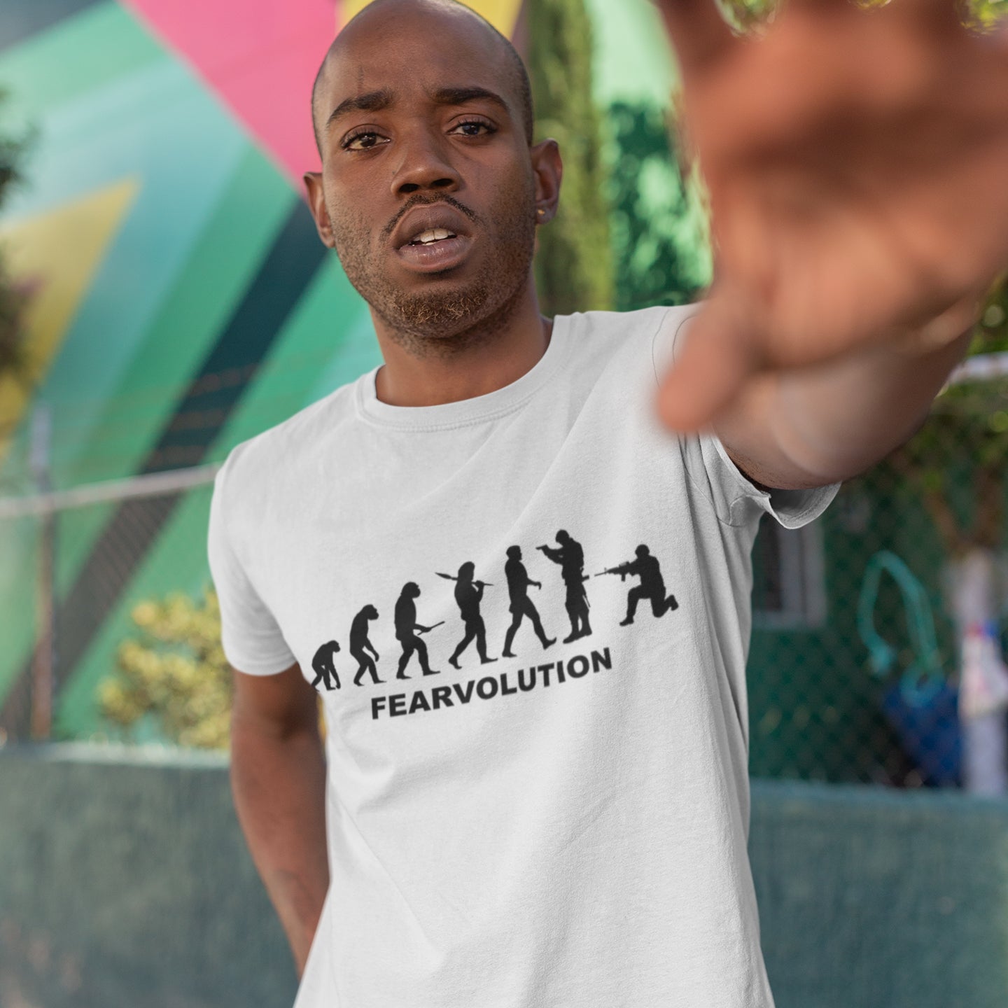 man wearing White t-shirt. This social issues t-shirt displays an alternative view of how we may evolve from here on. Fear is holding us back, fear of change. Made from 100% organic ring-spun cotton, this emotional intelligence t-shirt is unisex, high-quality, super comfy, and best of all, eco-friendly.