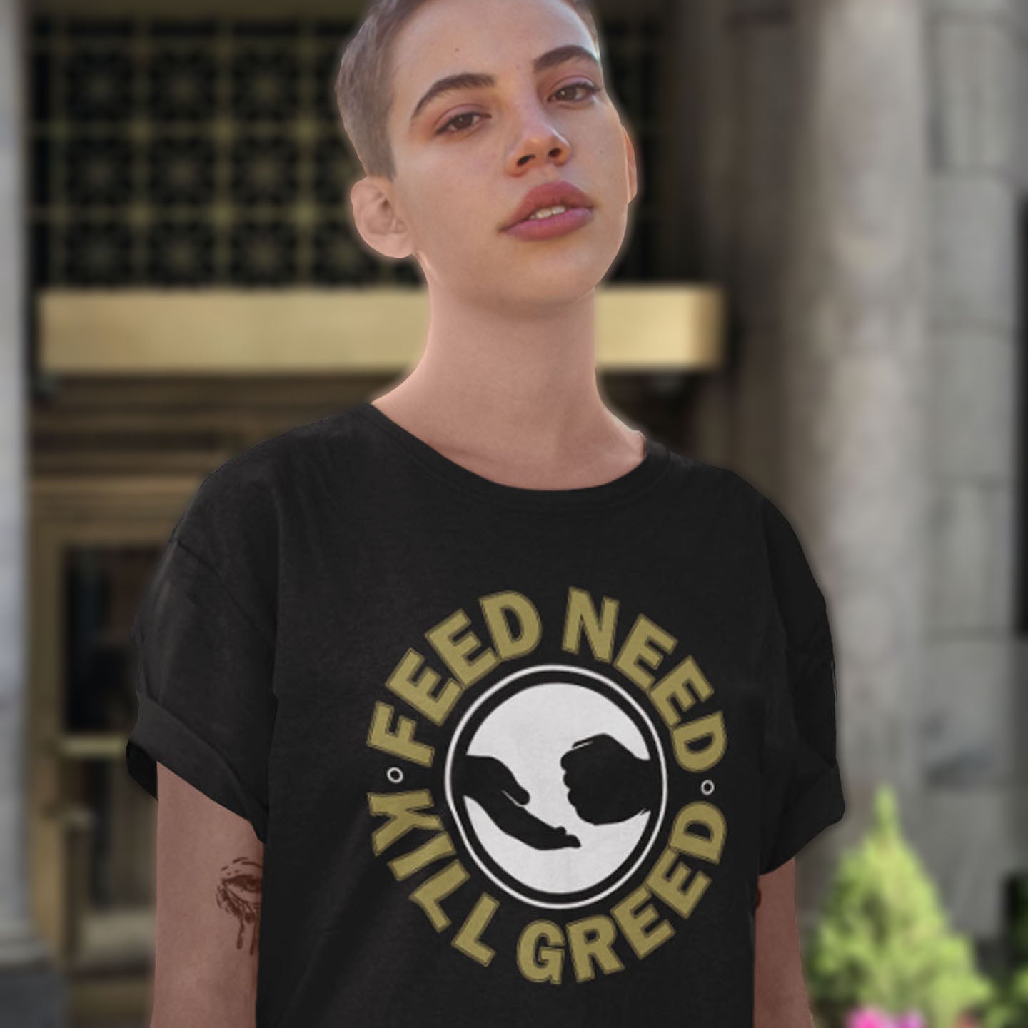 Person wearing a black t-shirt with a graphic design and text. An anti government t shirt. At the root of most political corruption is the concentration of greed over need. Made from 100% organic ring-spun cotton, this dystopian t shirt design is unisex, high-quality, super comfy, and best of all, eco-friendly.