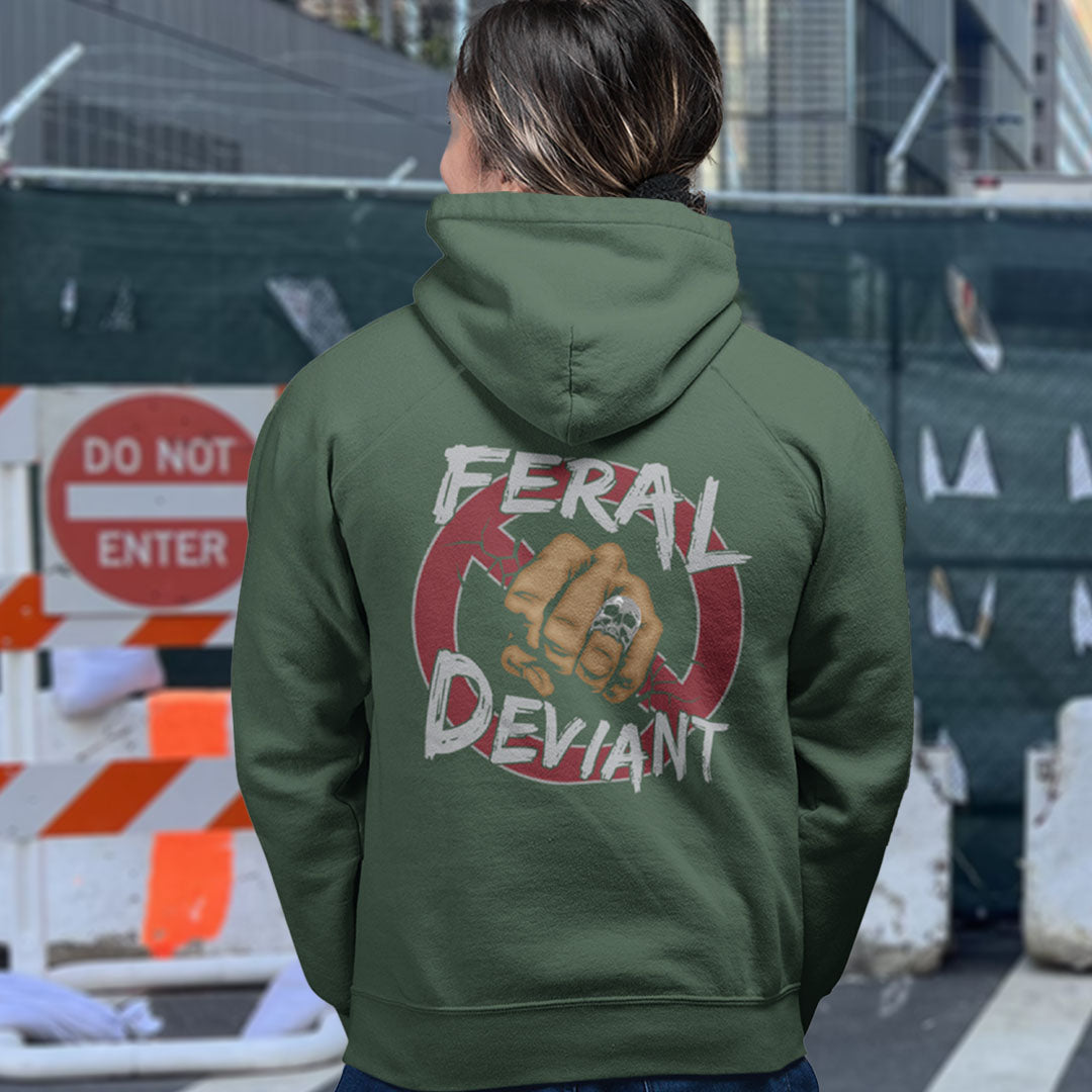 Person wearing a green hoodie with a graphic design on the back, standing in an urban setting. A non conformist hoodie for people who think boundaries stifle creativity, and rules are only guidelines. This alternative, anti establishment hoodie is perfect for any demonstration or protest march of your choice. Comfortable and practical. It's extra soft and has a convenient front pouch pocket. Made from organic cotton and recycled polyester, this street art inspired hoodie is a great eco-friendly choice.