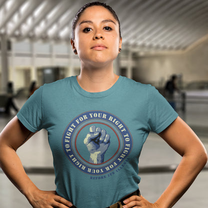 Person wearing a stargazer t-shirt with a graphic design in an indoor setting. A civil rights t-shirt reminding us not to take our freedom for granted. Fight for your right to demonstrate before it's made illegal. Made from 100% organic ring-spun cotton, this anti-establishment t-shirt is unisex, high-quality, super comfy, and best of all, eco-friendly.