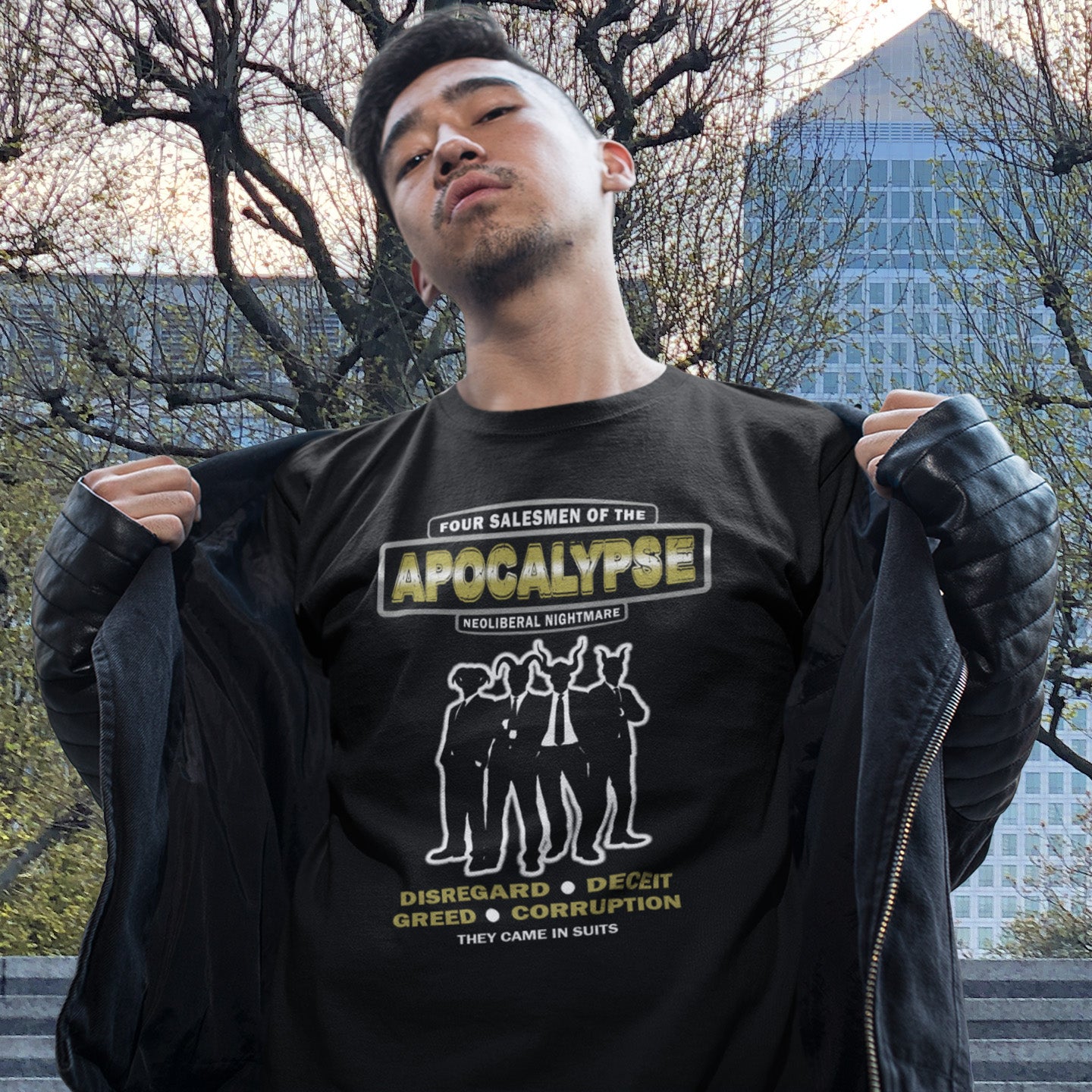 Person wearing a black t-shirt with graphic design and text outdoors. An anti capitalism t shirt with a biblical undertone. A satirical design looking at how neoliberalism could bring on the downfall of civilised society and the form it will take. Made from 100% organic ring-spun cotton, this non conformist t shirt is a total must-have. It's high-quality, super comfy, and best of all—eco-friendly.