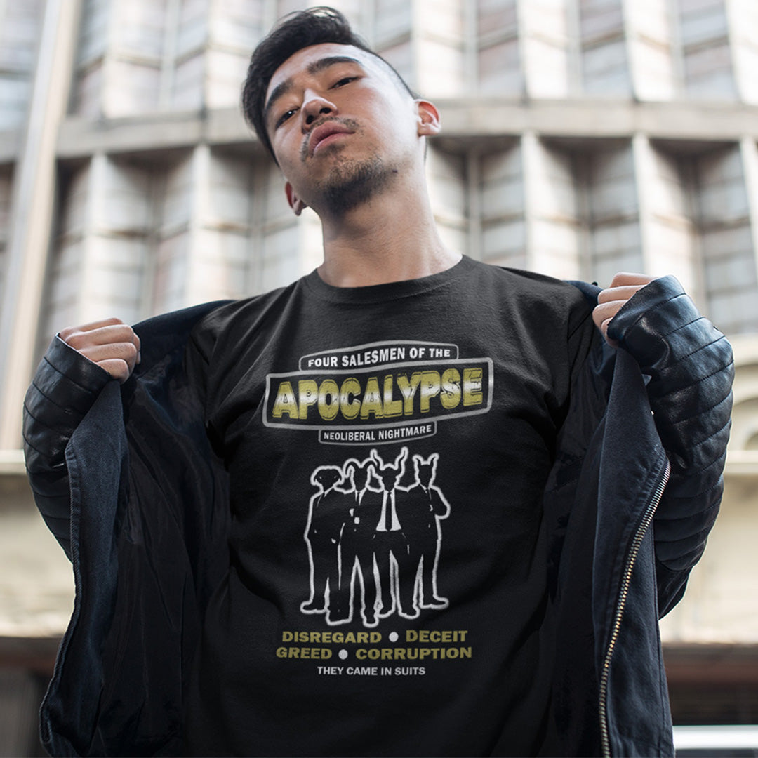 Person wearing a black t-shirt with graphic design and text, standing outdoors. An anti capitalism t shirt with a biblical undertone. A satirical design looking at how neoliberalism and it's hidden inequalities could bring on the downfall of civilised society and the form it will take. Made from 100% organic ring-spun cotton, this non conformist t shirt is a total must-have. It's high-quality, super comfy, and best of all, eco-friendly.