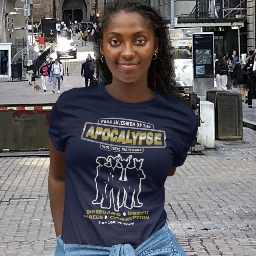 Person wearing a navy blue t-shirt with graphic design and text on a city street. An anti capitalism t shirt with a biblical undertone. A satirical design looking at how neoliberalism and it's hidden inequalities could bring on the downfall of civilised society and the form it will take. Made from 100% organic ring-spun cotton, this non conformist t shirt is a total must-have. It's high-quality, super comfy, and best of all, eco-friendly.