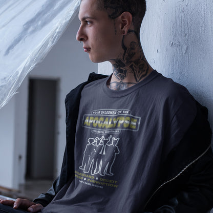 Person wearing a graphic t-shirt leaning against a wall indoors. A political t-shirt with a biblical undertone. A satirical design looking at how neoliberalism could bring on the downfall of civilised society and the form it will take. Made from 100% organic ring-spun cotton, this unisex political t-shirt is a total must-have. It's high-quality, super comfy, and best of all—eco-friendly.