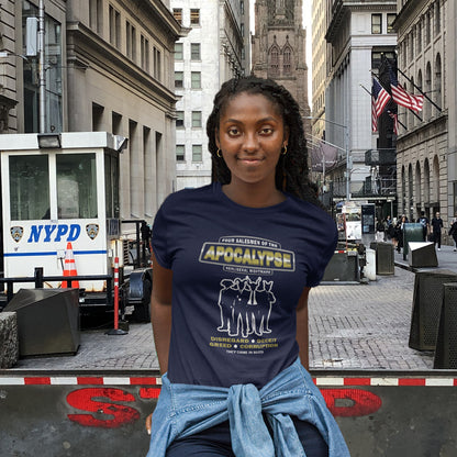Woman wearing a blue t-shirt with graphic design on a city street with an NYPD vehicle in the background. A political t-shirt with a biblical undertone. A satirical design looking at how neoliberalism could bring on the downfall of civilised society and the form it will take. Made from 100% organic ring-spun cotton, this unisex political t-shirt is a total must-have. It's high-quality, super comfy, and best of all—eco-friendly.