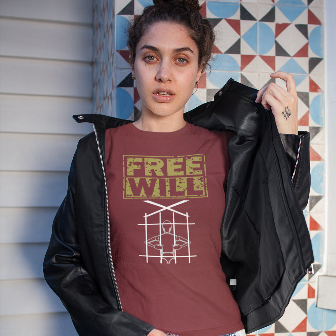 A woman holding her jacket open and wearing a burgundy t-shirt with "FREE WILL" text above a puppet in prison.