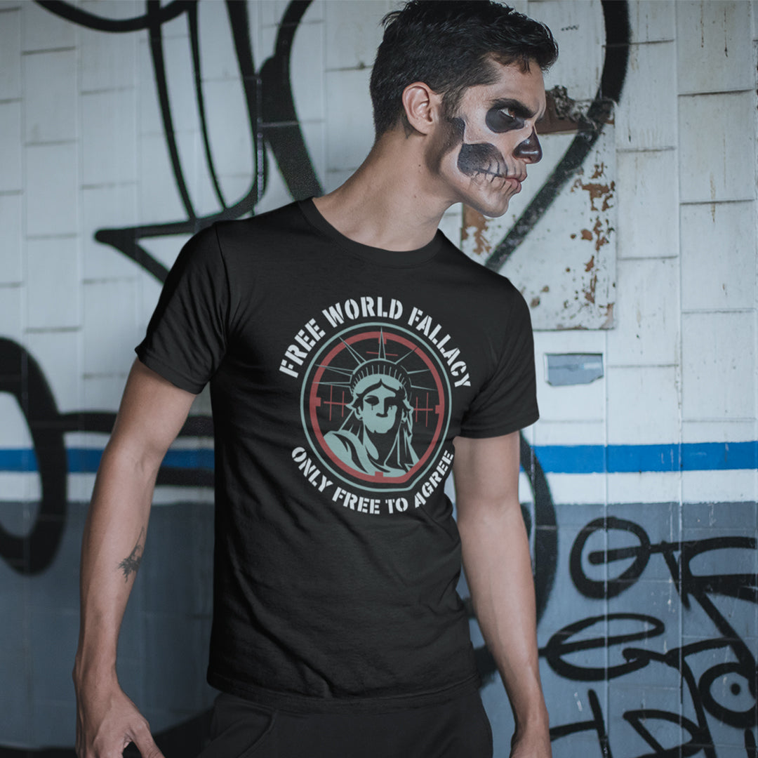 A man wearing a black graphic t-shirt with a skull and Statue of Liberty design, posed against a graffiti-covered wall.