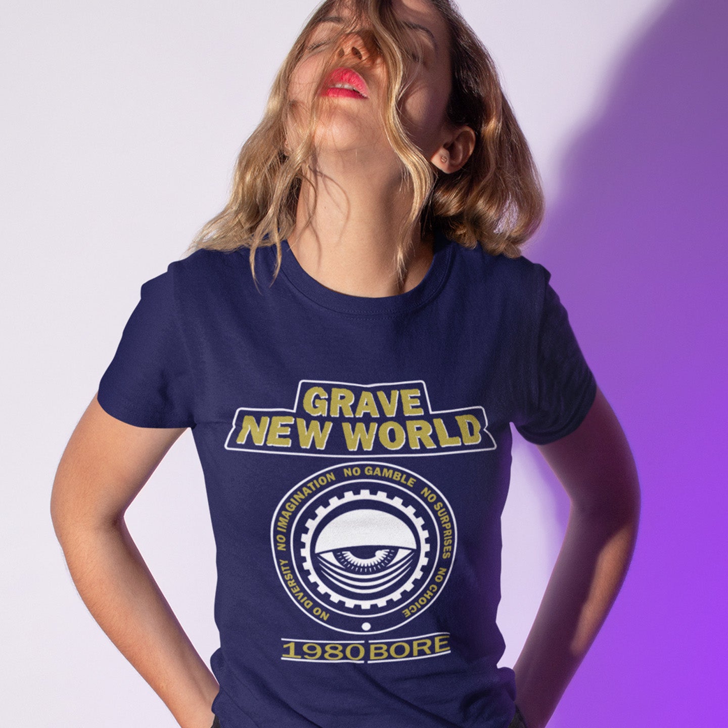 Person wearing a French blue t-shirt with 'Grave New World' text and design. A unique non conformist t shirt with a twist of satire. Neither George Orwell or Aldous Huxley mentioned how boring the new world would be under analytics and algorithms. A satirical dystopian t shirt design depicting a counter culture view. Made from 100% organic ring-spun cotton, this non conformist t shirt is unisex, high-quality, super comfy, and best of all, eco-friendly.