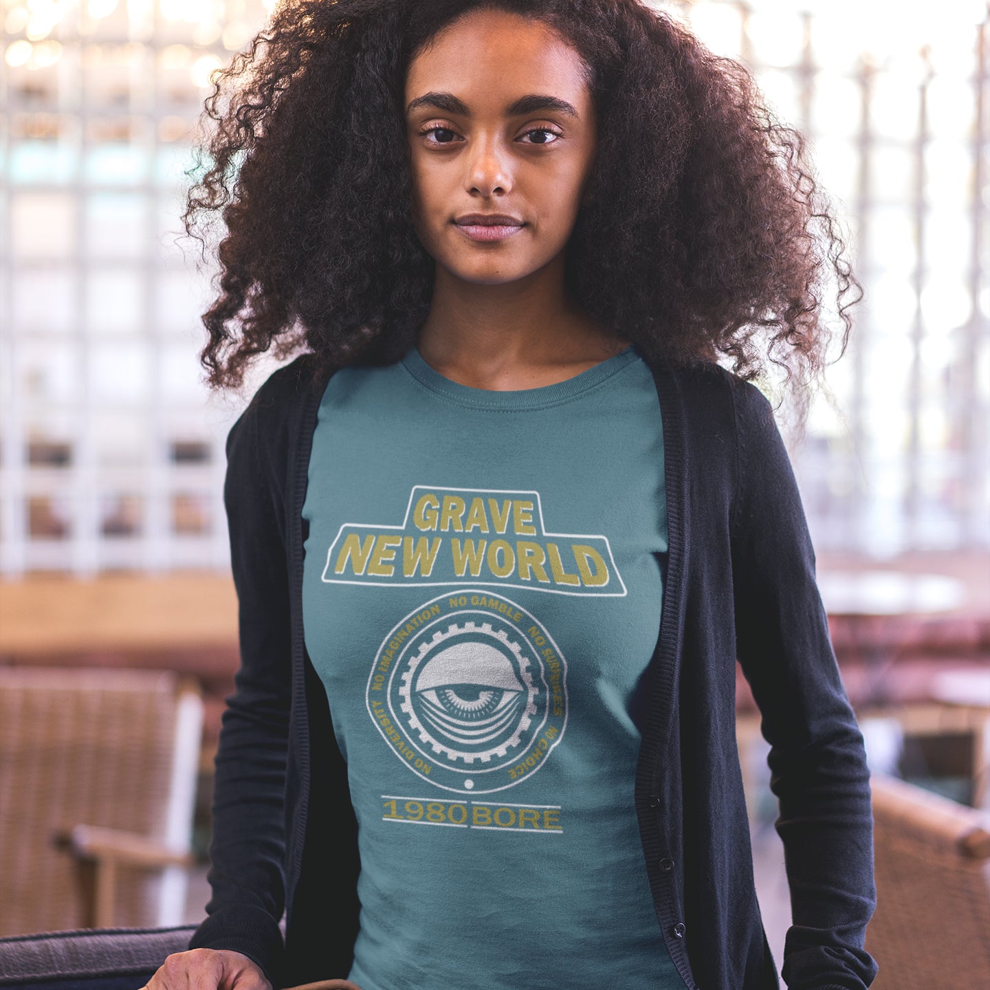 Person wearing a stargazer t-shirt with 'Grave New World' text and design. A unique non conformist t shirt with a twist of satire. Neither George Orwell or Aldous Huxley mentioned how boring the new world would be under analytics and algorithms. A satirical dystopian t shirt design depicting a counter culture view. Made from 100% organic ring-spun cotton, this non conformist t shirt is unisex, high-quality, super comfy, and best of all, eco-friendly.