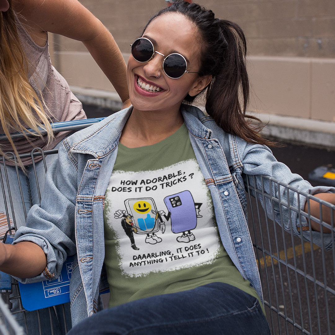 Woman wearing a t-shirt with a graphic design and text, standing in a parking lot. An anti mobile phone abuse t-shirt depicting a twisted view of what's really going on in some peoples relationship with their mobile phone. Sometimes you have to wonder who owns who. An original design to promote social awareness. Made from 100% organic ring-spun cotton, this anti smart phone abuse t-shirt is unisex, high-quality, super comfy, and best of all, eco-friendly.