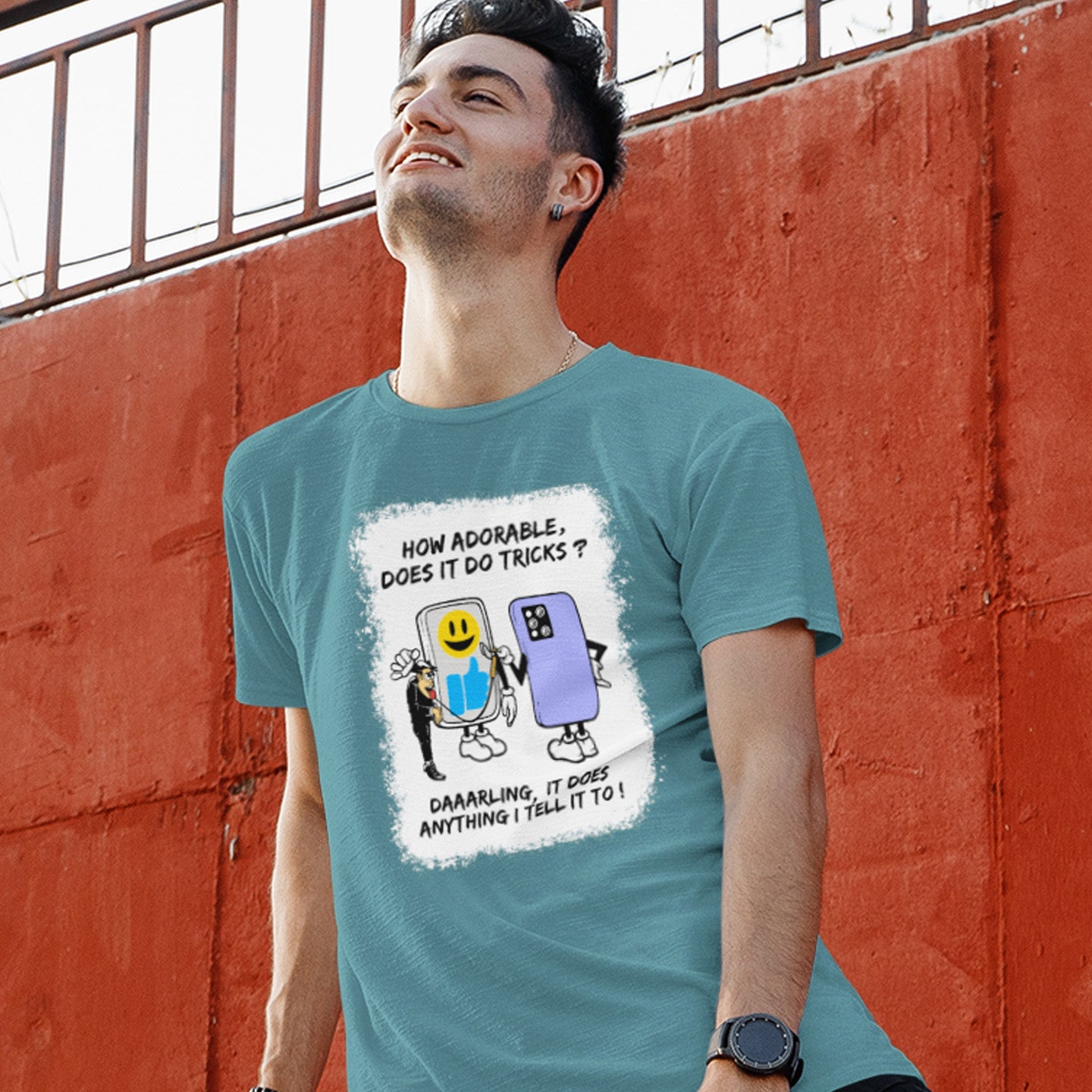 Person wearing a stargazer t-shirt with a graphic design against an orange wall. An satirical cartoon t-shirt depicting a twisted view of what's really going on in some peoples relationship with their mobile phone. Sometimes you have to wonder who owns who. An original design to promote social awareness. Made from 100% organic ring-spun cotton, this satirical cartoon t-shirt is unisex, high-quality, super comfy, and best of all, eco-friendly.