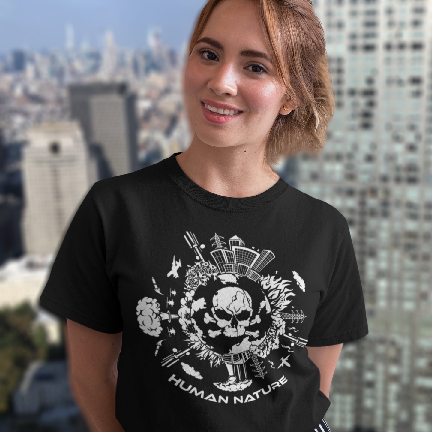 Person wearing a black t-shirt with a graphic design in an urban setting. This save the world t shirt claims human nature is nowhere near as good as mother nature. It's not only about environmental issues. How do we save the planet from human nature. Made from 100% organic ring-spun cotton, this save the earth t shirt is unisex, high-quality, super comfy, and best of all, eco-friendly.