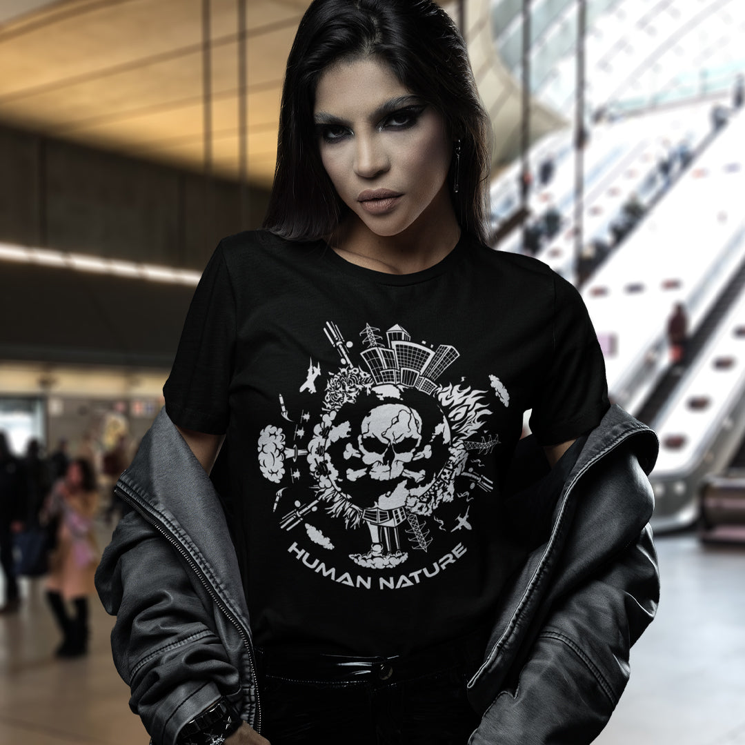 Person wearing a black t-shirt with a graphic design and text in an indoor setting. This save the world t shirt claims human nature is nowhere near as good as mother nature. It's not only about environmental issues. How do we save the planet from human nature. Made from 100% organic ring-spun cotton, this save the earth t shirt is unisex, high-quality, super comfy, and best of all, eco-friendly.