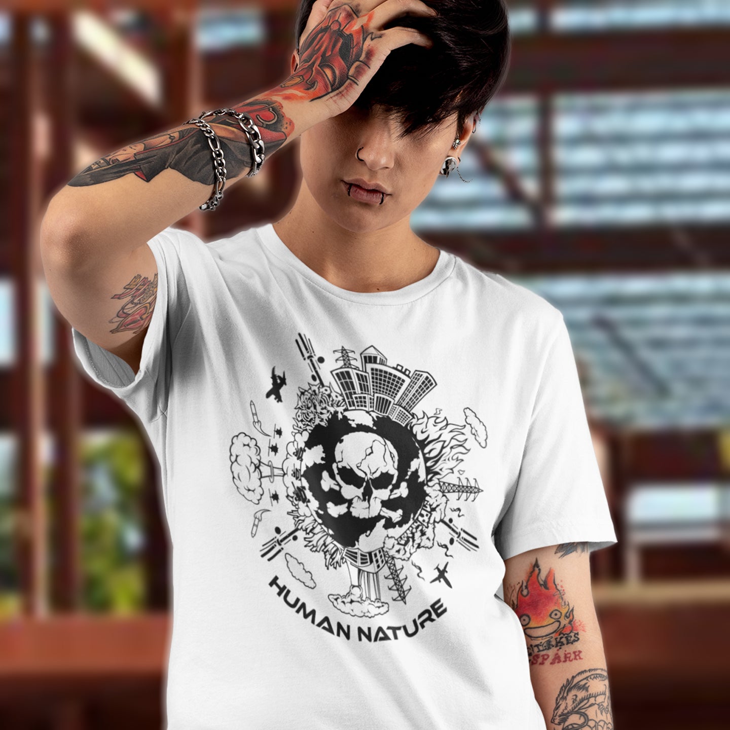 Person wearing a white t-shirt with a black graphic design and 'Human Nature' text. This save the world t shirt claims human nature is nowhere near as good as mother nature. It's not only about environmental issues. How do we save the planet from human nature. Made from 100% organic ring-spun cotton, this save the earth t shirt is unisex, high-quality, super comfy, and best of all, eco-friendly.