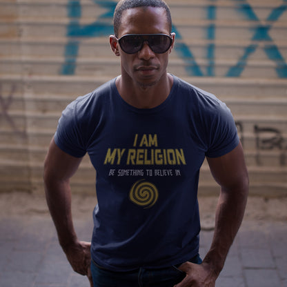 Man wearing a French navy blue t-shirt with yellow text and graphics, standing on steps.