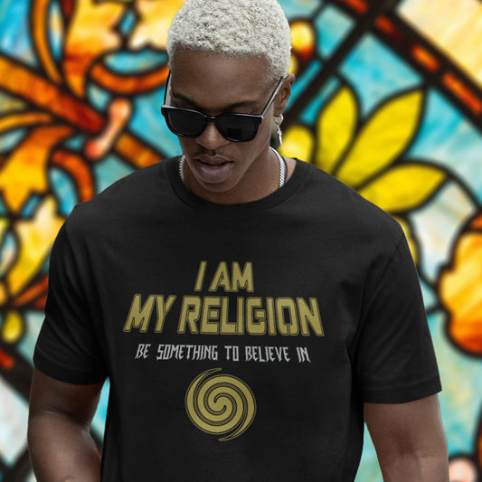 Person wearing a black t-shirt with 'I AM MY RELIGION' text in front of a colourful stained glass window. A self worth t shirt design for the self assured. If you think it's best to believe in something workable then be something you can believe in. Help create social awareness of self respect. Made from 100% organic ring-spun cotton, this self worth t shirt is unisex, high-quality, super comfy, and best of all, eco-friendly.