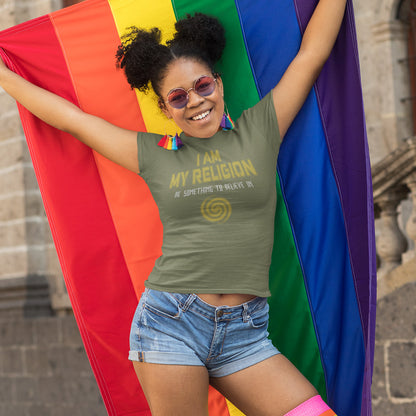 Person wearing a khaki t-shirt with text, denim shorts, and sunglasses, standing behind a rainbow flag. A self worth t shirt design for the self assured. If you think it's best to believe in something workable then be something you can believe in. Help create social awareness of self respect. Made from 100% organic ring-spun cotton, this self worth t shirt is unisex, high-quality, super comfy, and best of all, eco-friendly.