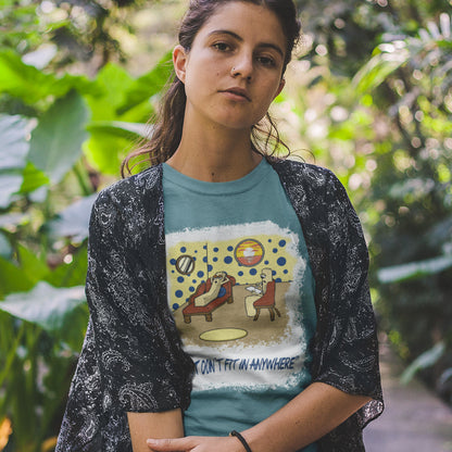 Woman wearing a graphic t-shirt with a design and text, standing in a natural setting. A funny non conformist t shirt for all you 'square pegs in round holes' out there. You are not alone. This unique design is ideal for anyone who thinks outside the box. Made from 100% organic ring-spun cotton, this sarcastic slogan t shirt is unisex, high-quality, super comfy, and best of all, eco-friendly.
