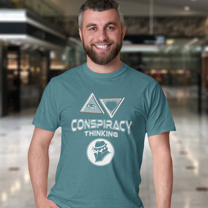 Man wearing a stargazer t-shirt with 'Conspiracy Thinking' design in an indoor setting. A cryptic conspiracy theory t-shirt design for all of those conspiracy theory lovers out there who know it's more than a theory, it's a way of life. From Alien advocates or bigfoot believers to Cabal conspiracy theorists, an original design for all. Made from 100% organic ring-spun cotton, this conspiracy theory t-shirt is unisex, high-quality, super comfy, and best of all, eco-friendly.