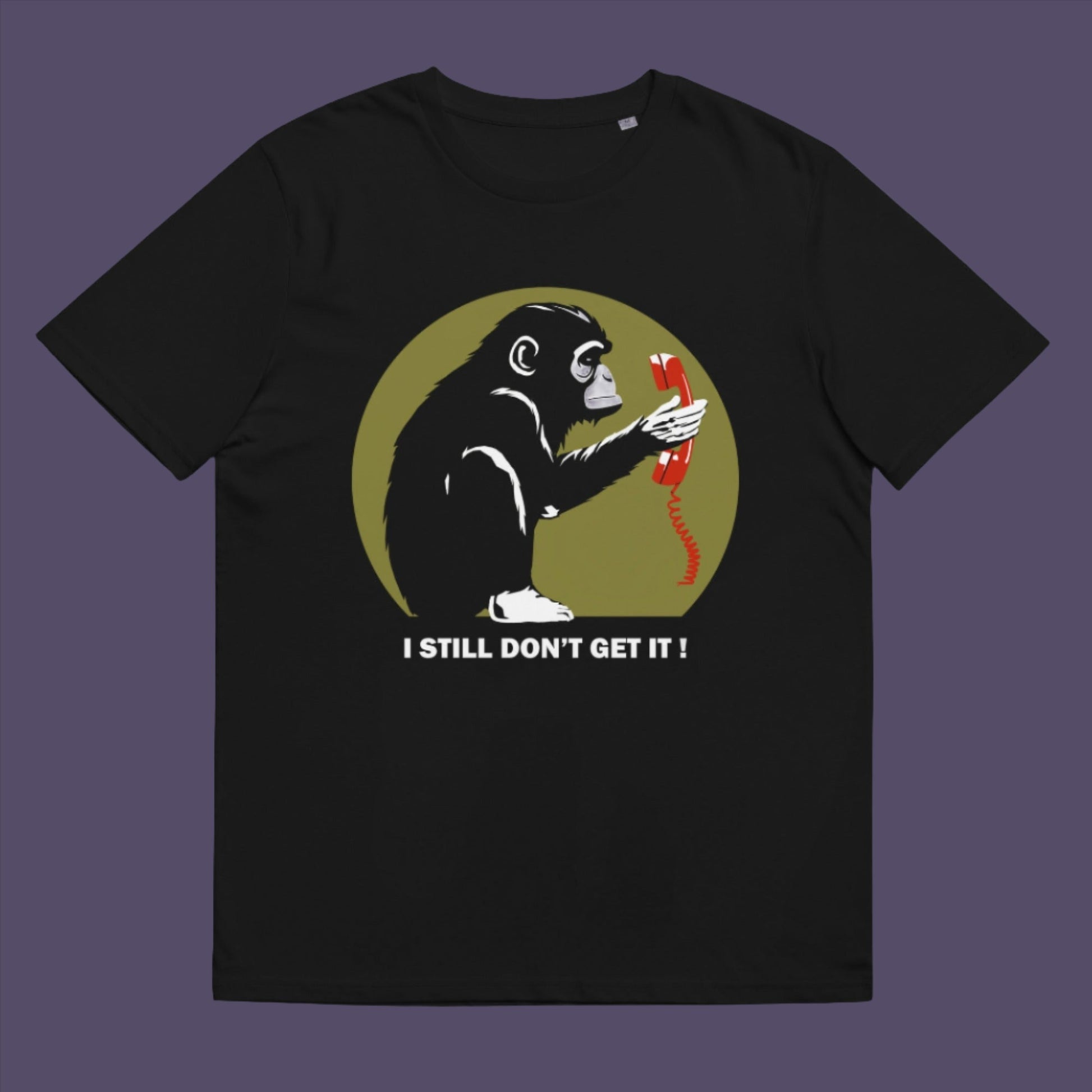 Black t-shirt. This anti smart phone abuse t-shirt design highlights the human obsession with smart phones and how strange it must look to an ape. An outsiders view of a world glued to mobile phones. Made from 100% organic ring-spun cotton, this anti mobile phone abuse t-shirt is unisex, high-quality, super comfy, and best of all, eco-friendly.