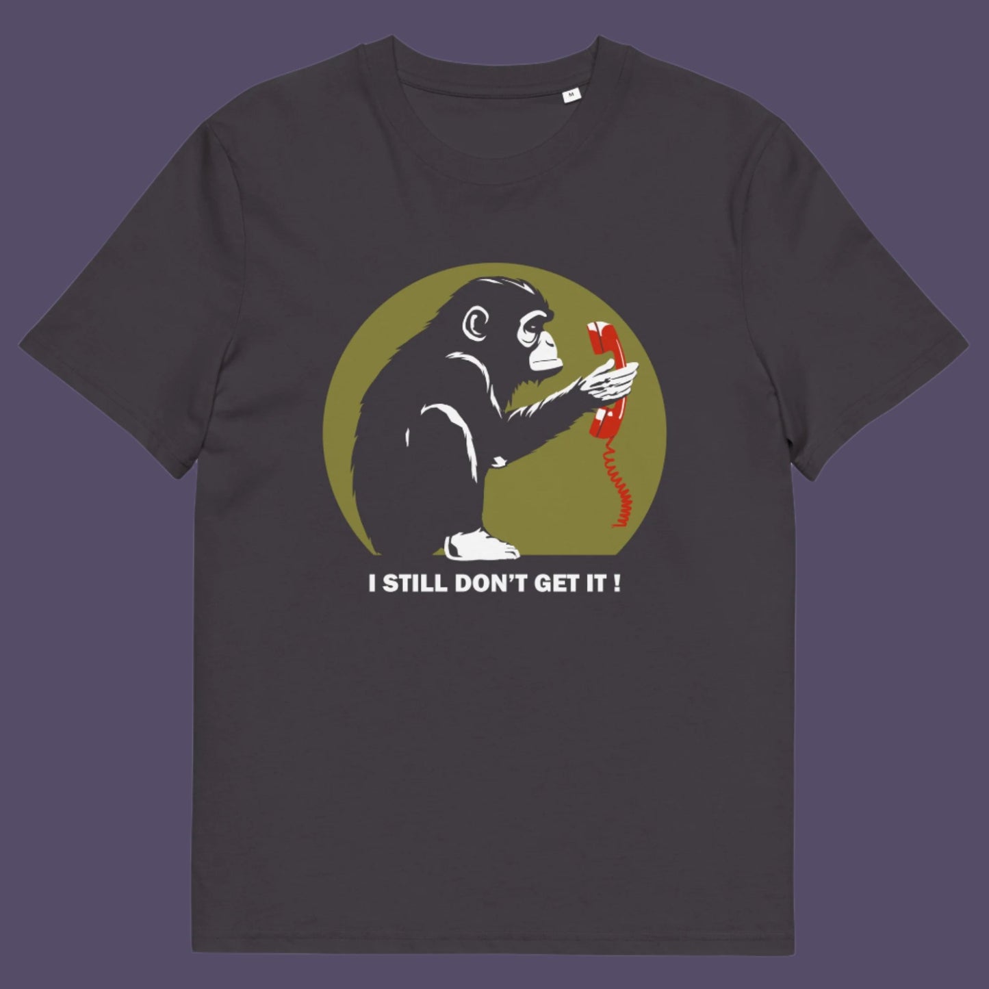 Anthracite t-shirt. This satirical Banksy style stencil art t-shirt design highlights the human obsession with smart phones and how strange it must look to an ape. An outsiders view of a world glued to mobile phones. Made from 100% organic ring-spun cotton, this street art social awareness t-shirt is unisex, high-quality, super comfy, and best of all, eco-friendly.