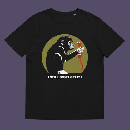 Black t-shirt. This satirical Banksy style stencil art t-shirt design highlights the human obsession with smart phones and how strange it must look to an ape. An outsiders view of a world glued to mobile phones. Made from 100% organic ring-spun cotton, this street art social awareness t-shirt is unisex, high-quality, super comfy, and best of all, eco-friendly.