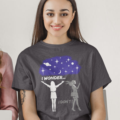 Woman wearing a t-shirt with a graphic design of two people under a starry sky with text 'I wonder... I don't!'. This anti mobile phone abuse t shirt light heartedly pokes fun at people who never look up from their phone. If you believe letting a machine do most of your thinking for you will dull your imagination, this satirical design is for you. Made from 100% organic ring-spun cotton, these anti mobile phone abuse t shirts are unisex, high quality, super comfy, and best of all, eco-friendly.
