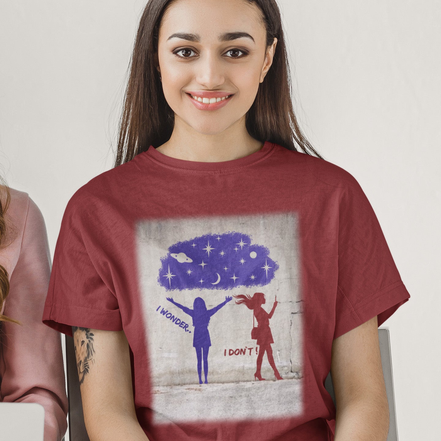 Woman wearing a burgundy t-shirt with a graphic design of two people and a cloud. This anti mobile phone abuse t shirt light heartedly pokes fun at people who never look up from their phone. If you believe letting a machine do most of your thinking for you will dull your imagination, this satirical design is for you. Made from 100% organic ring-spun cotton, these anti mobile phone abuse t shirts are unisex, high quality, super comfy, and best of all, eco-friendly.