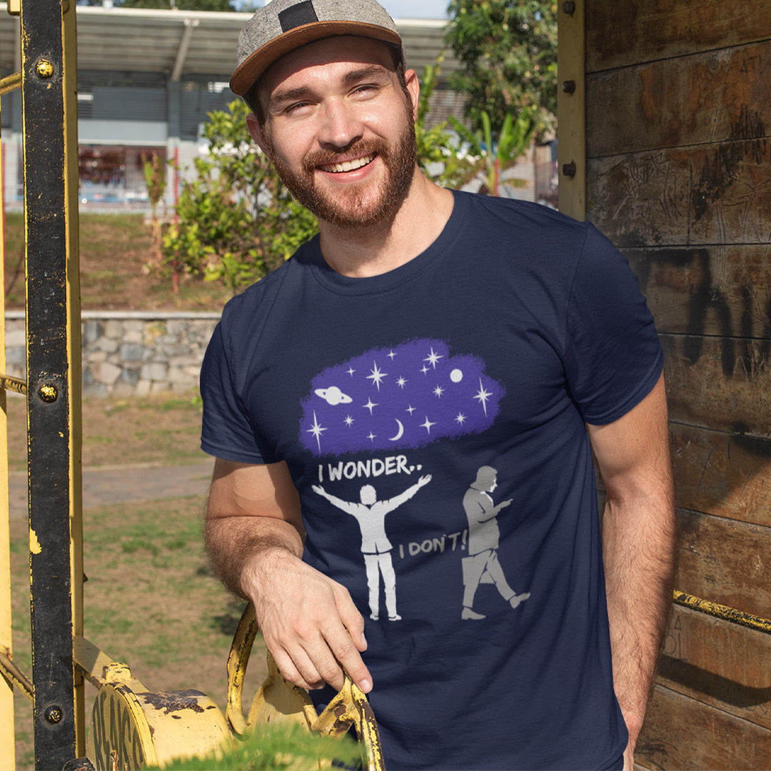 Man wearing a navy blue t-shirt with a graphic design outdoors. This anti mobile phone abuse t shirt light heartedly pokes fun at people who never look up from their phone. If you believe letting a machine do most of your thinking for you will dull your imagination, this satirical design is for you. Made from 100% organic ring-spun cotton, these anti mobile phone abuse t shirts are unisex, high quality, super comfy, and best of all, eco-friendly.