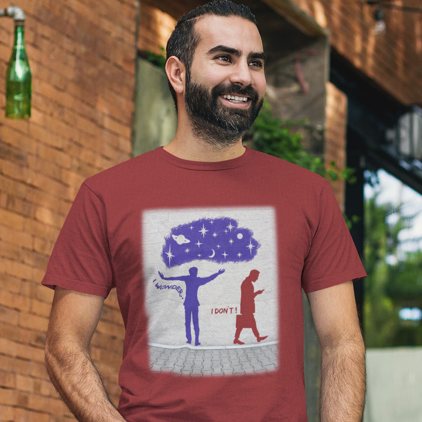 Man wearing a burgundy t-shirt with a graphic design outdoors. This anti mobile phone abuse t shirt light heartedly pokes fun at people who never look up from their phone. If you believe letting a machine do most of your thinking for you will dull your imagination, this satirical design is for you. Made from 100% organic ring-spun cotton, these anti mobile phone abuse t shirts are unisex, high quality, super comfy, and best of all, eco-friendly.